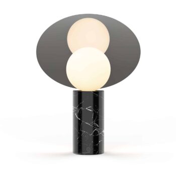 The Bola Disc Table lamp combines a contemporary black marble base with a cylindrical design and a circular mirror disc that reflects the gentle glow of its oval white light.
