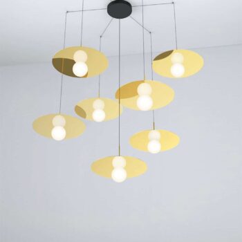 The Bola Disc Multi-Light Canopy is a modern chandelier with seven yellow-gold, disc-shaped fixtures, each holding two white bulbs. These are elegantly suspended from a black canopy for a stunning display.
