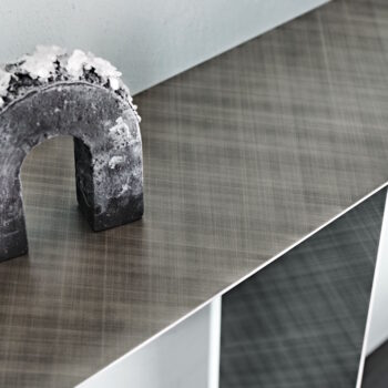 tee console table with minimal lines and industrial design in a modern open-plan living space