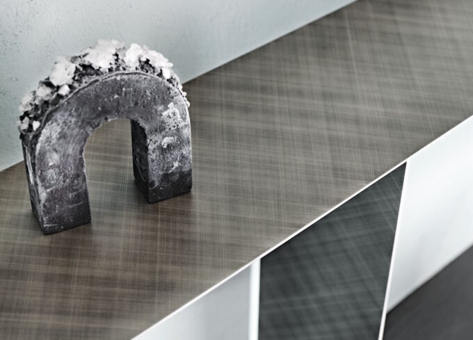 tee console table with minimal lines and industrial design in a modern open-plan living space