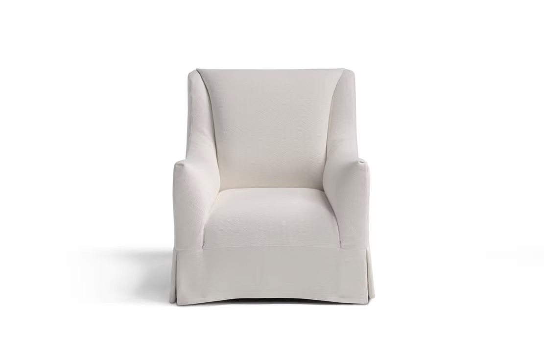 A front view of the Ralph Sofa, featuring white upholstery and a skirted base, set against a plain white background.