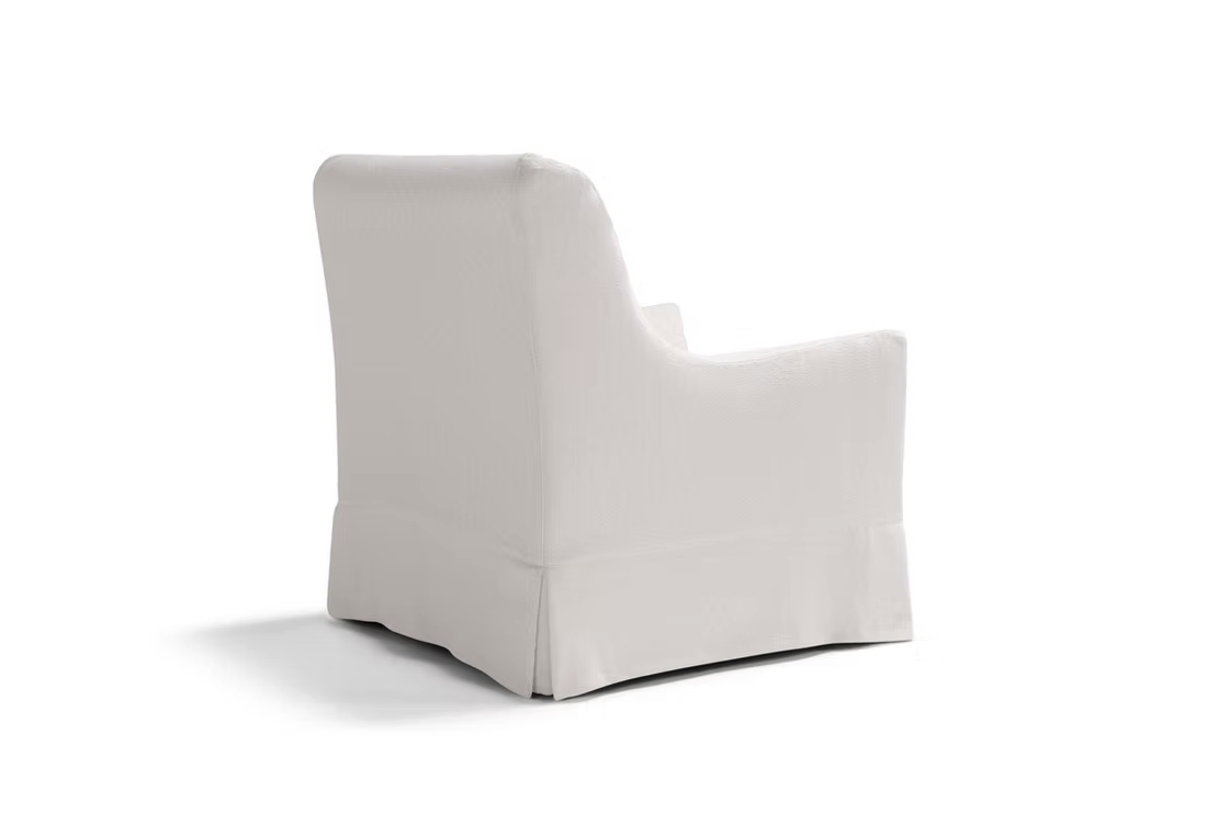 The Ralph Sofa, upholstered in white with a skirted bottom, is pictured from the back and slightly angled on a plain white background.