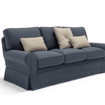 The Pantelleria Sofa is a blue upholstered three-seater with three seat cushions and three beige throw pillows, displayed against a white background.