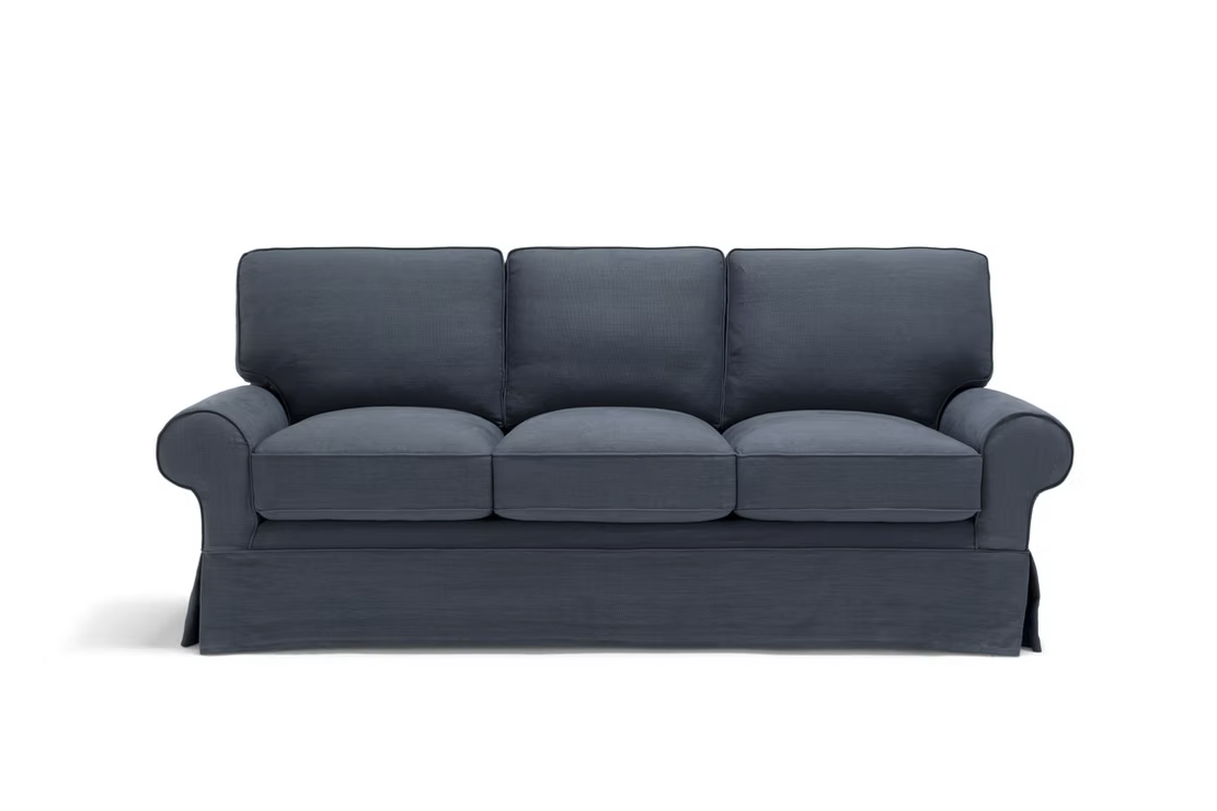 The Pantelleria Sofa, a modern blue three-seater with rolled arms and three seat and backrest cushions, is set against a plain white background.