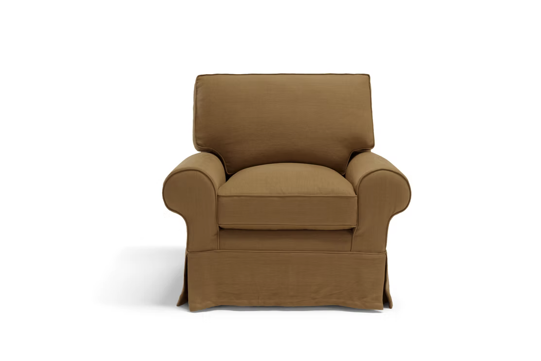 A brown upholstered armchair with rolled arms, a cushioned seat and backrest, and a tailored skirt is displayed next to the Pantelleria Sofa against a white background.