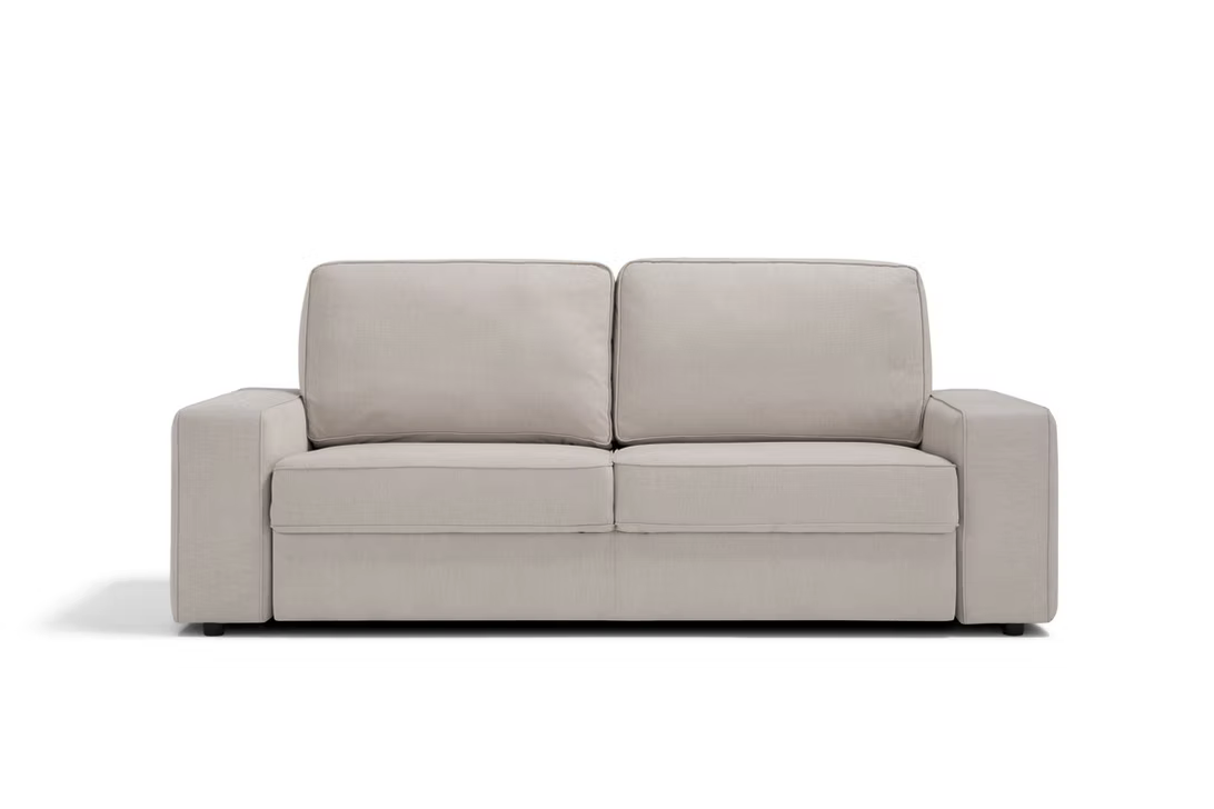 The Twin Sofa-bed is a modern, beige piece featuring plush cushions and wide armrests, displayed against a plain white background.