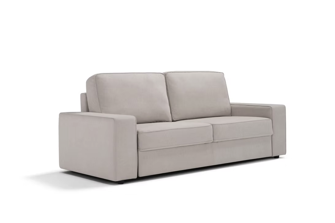 The Twin Sofa-bed is a modern light beige sofa-bed featuring wide armrests and two seat cushions, set against a plain white background.