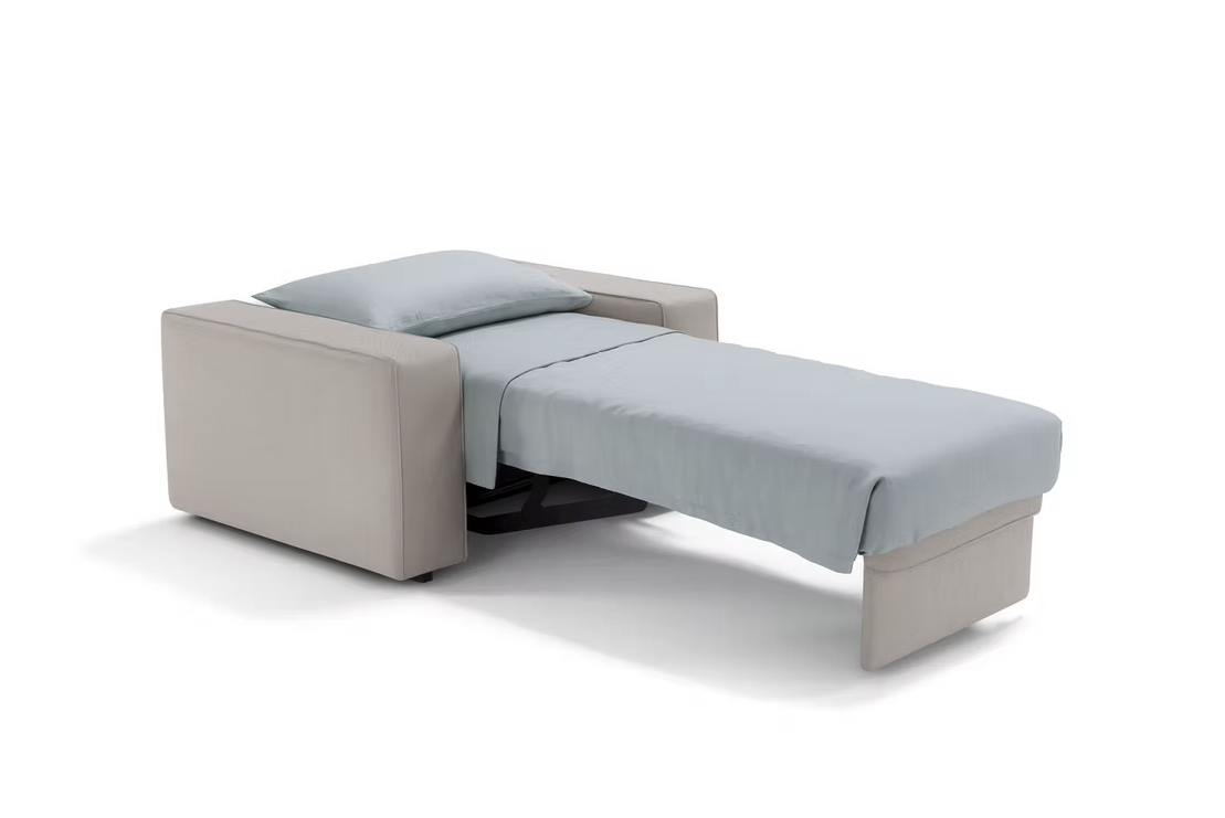The Twin Sofa-bed in beige unfolds into a single bed with a light blue sheet and pillow, shown on a white background.